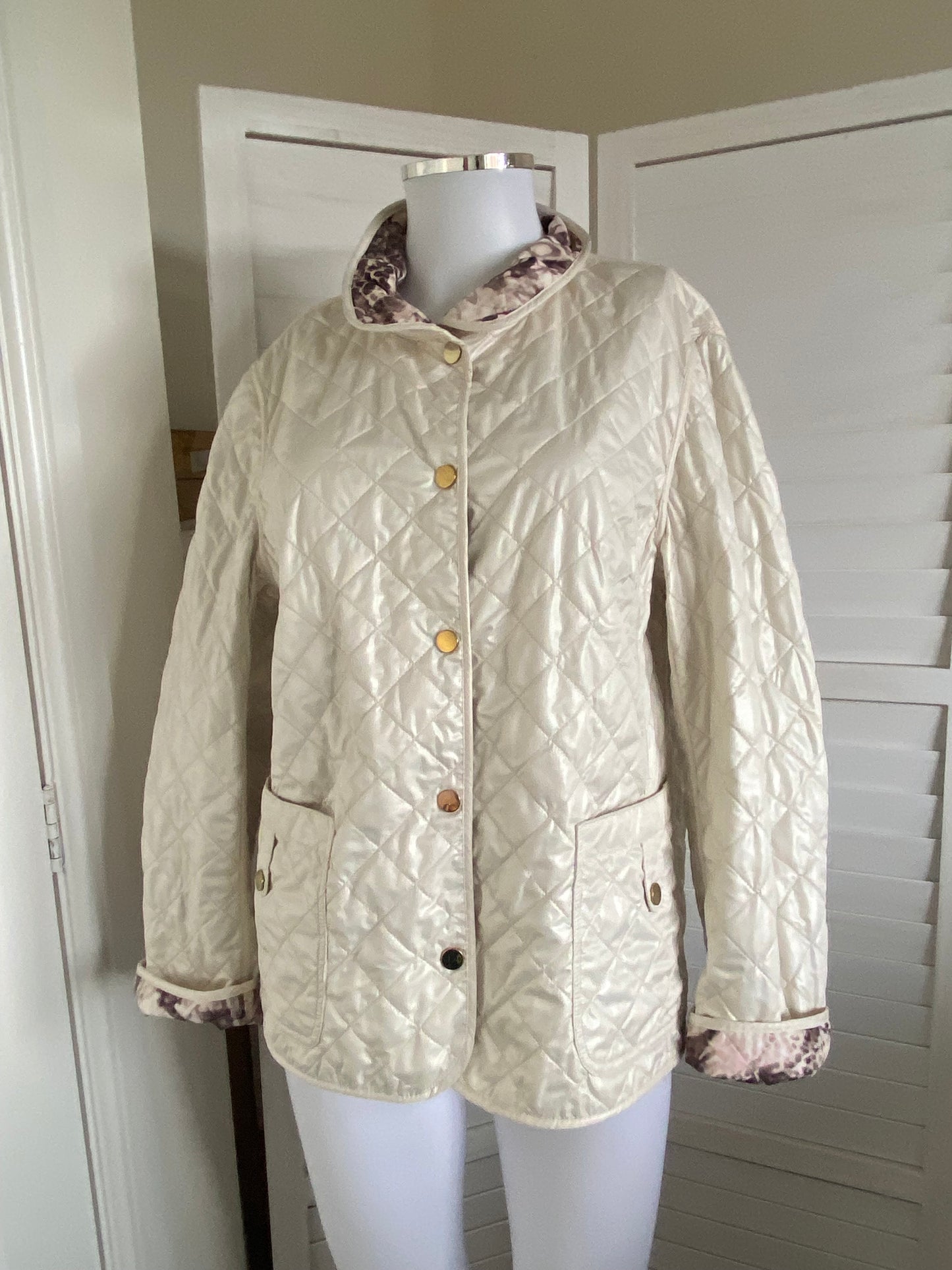 Cream quilted coat with snake print lining size 14