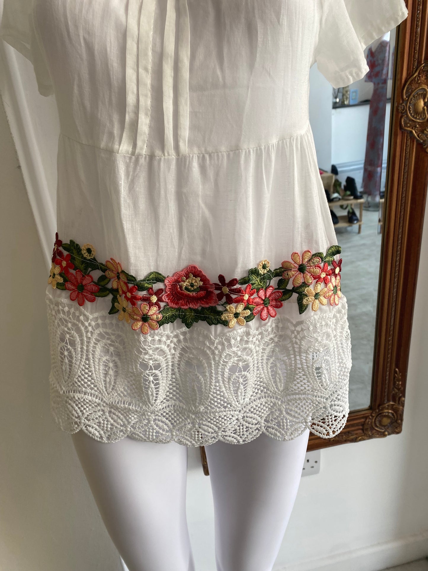 White top with floral embroidery